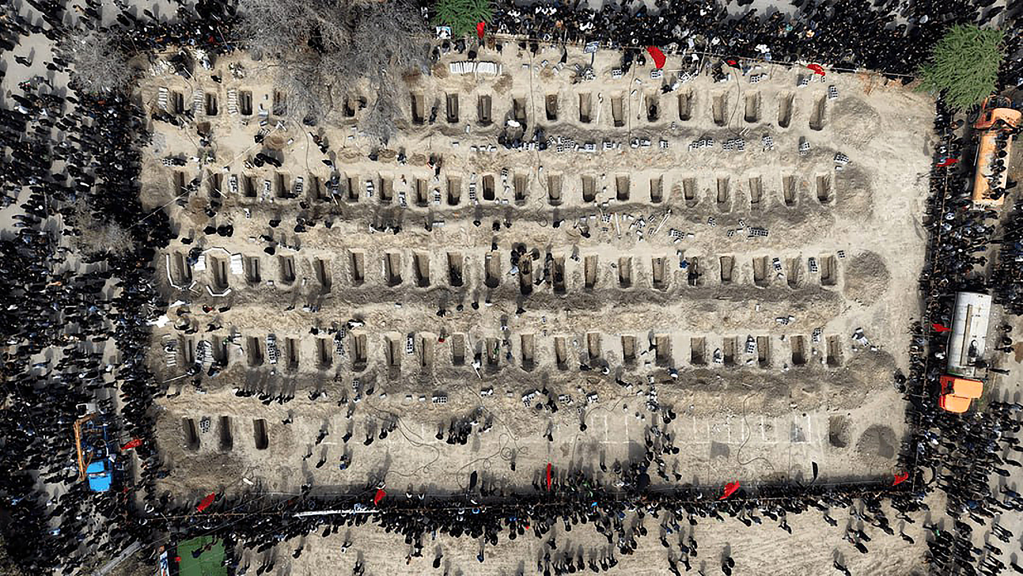 Mourners dig graves during a funeral for children killed in a US-Israeli air strike on a girls' elementary school in Minab, Hormozgan Province, Iran, March 3, 2026. /VCG