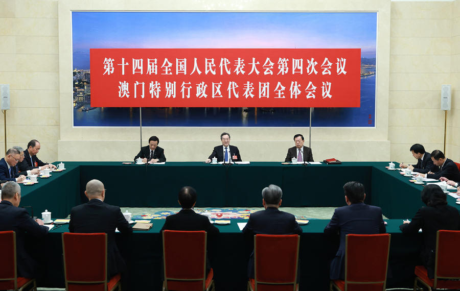 Ding Xuexiang, a member of the Standing Committee of the Political Bureau of the Communist Party of China Central Committee and vice premier, attends group deliberations with deputies from Macao Special Administrative Region at the fourth session of the 14th National People's Congress in Beijing, China, March 7, 2026. /Xinhua