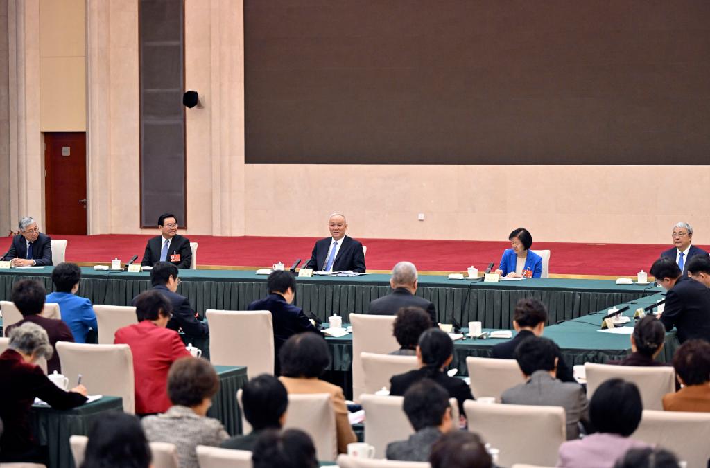 Cai Qi, a member of the Standing Committee of the Political Bureau of the Communist Party of China (CPC) Central Committee and a member of the Secretariat of the CPC Central Committee, participates in a joint group meeting of political advisors from the China Democratic League, the Communist Youth League of China, the All-China Youth Federation, and the All-China Women's Federation at the fourth session of the 14th National Committee of the Chinese People's Political Consultative Conference (CPPCC) in Beijing, capital of China, March 6, 2026. /Xinhua