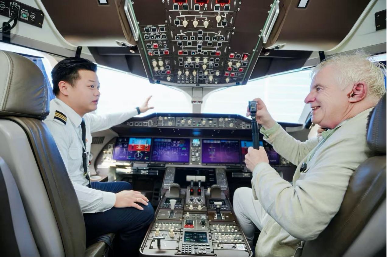 Global influencers visit China's homegrown large passenger jet C919, Guangzhou, south China's Guangdong Province, March 6, 2026. /China Southern Airlines