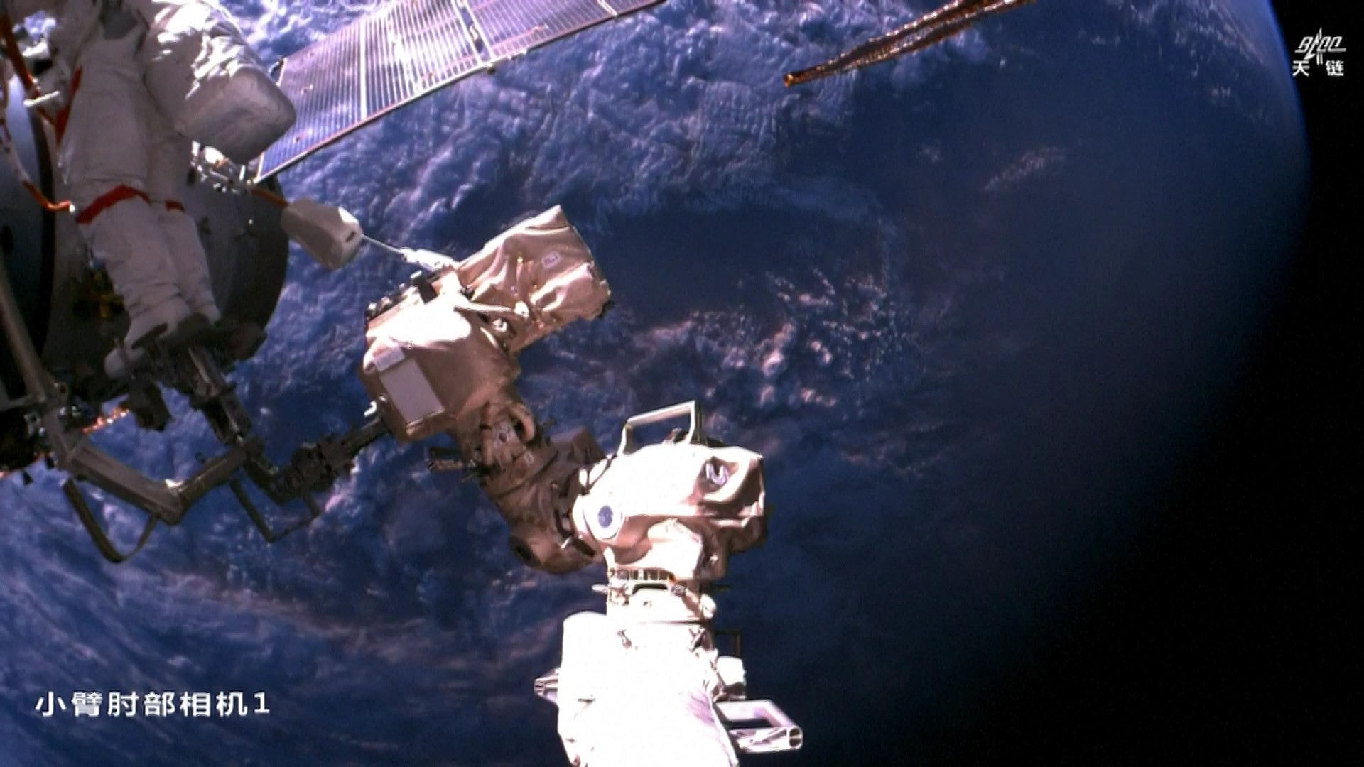 The Shenzhou-21 crew performs a spacewalk outside the China Space Station, December 9, 2025. /CMSA