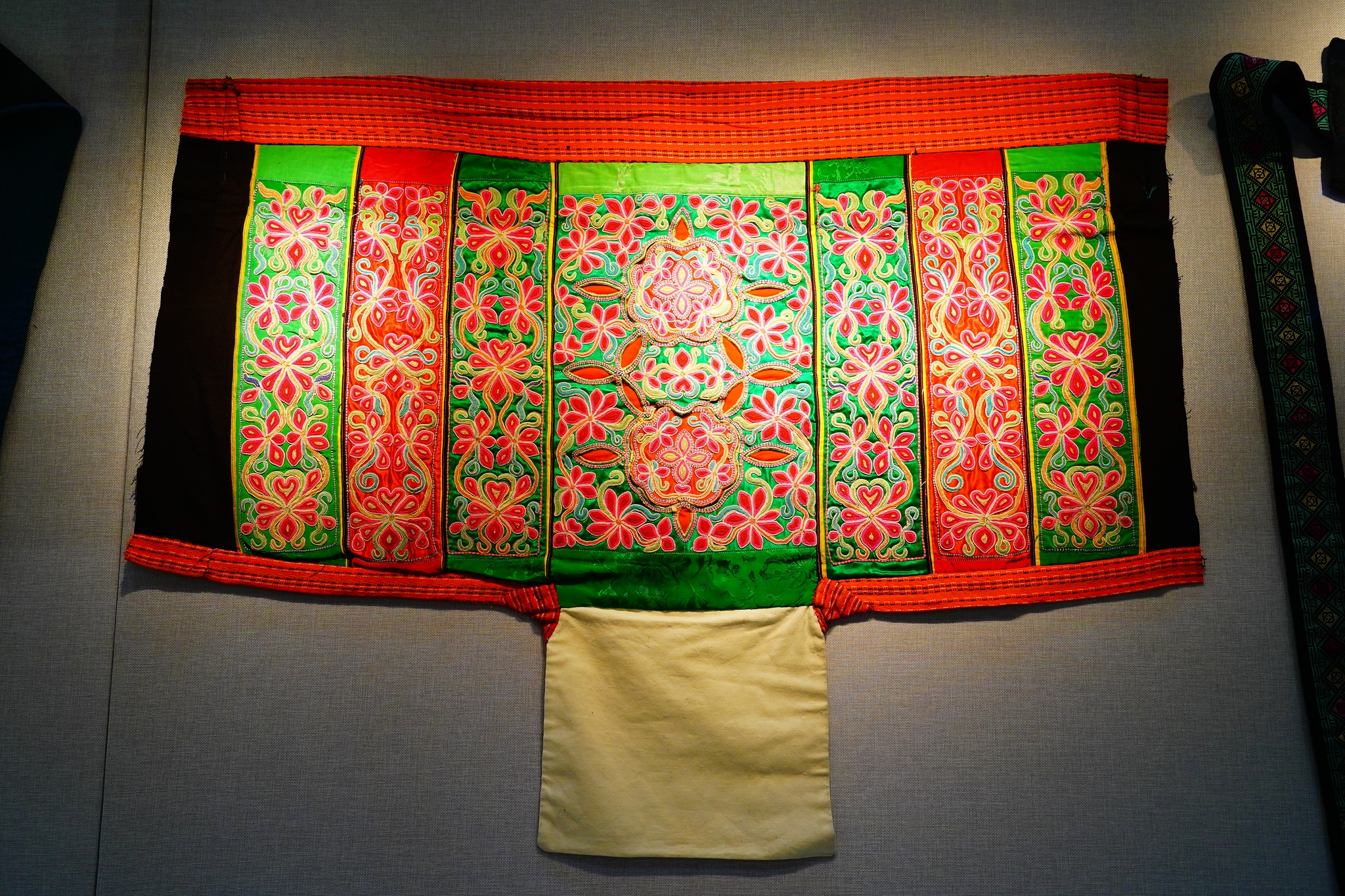 Cloth baby carriers from ethnic groups in southwest China are displayed at the Chinese Traditional Culture Museum in Beijing on January 21, 2026. /VCG