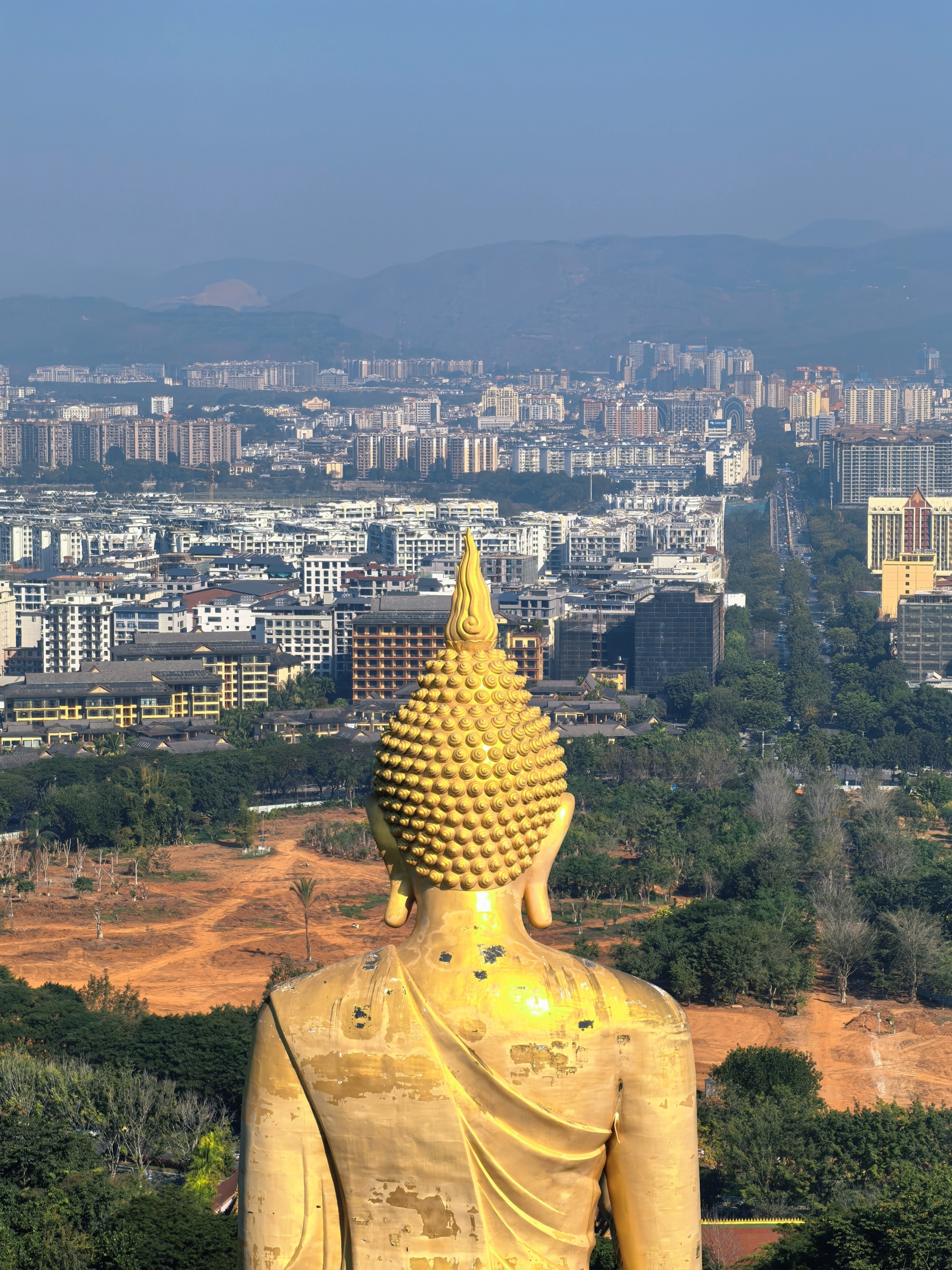 The 49-meter-tall Auspicious Buddha (Sakyamuni) statue of the Mengle Grand Buddhist Temple is seen in Xishuangbanna, southwest China's Yunnan Province on February 6, 2026. /CGTN