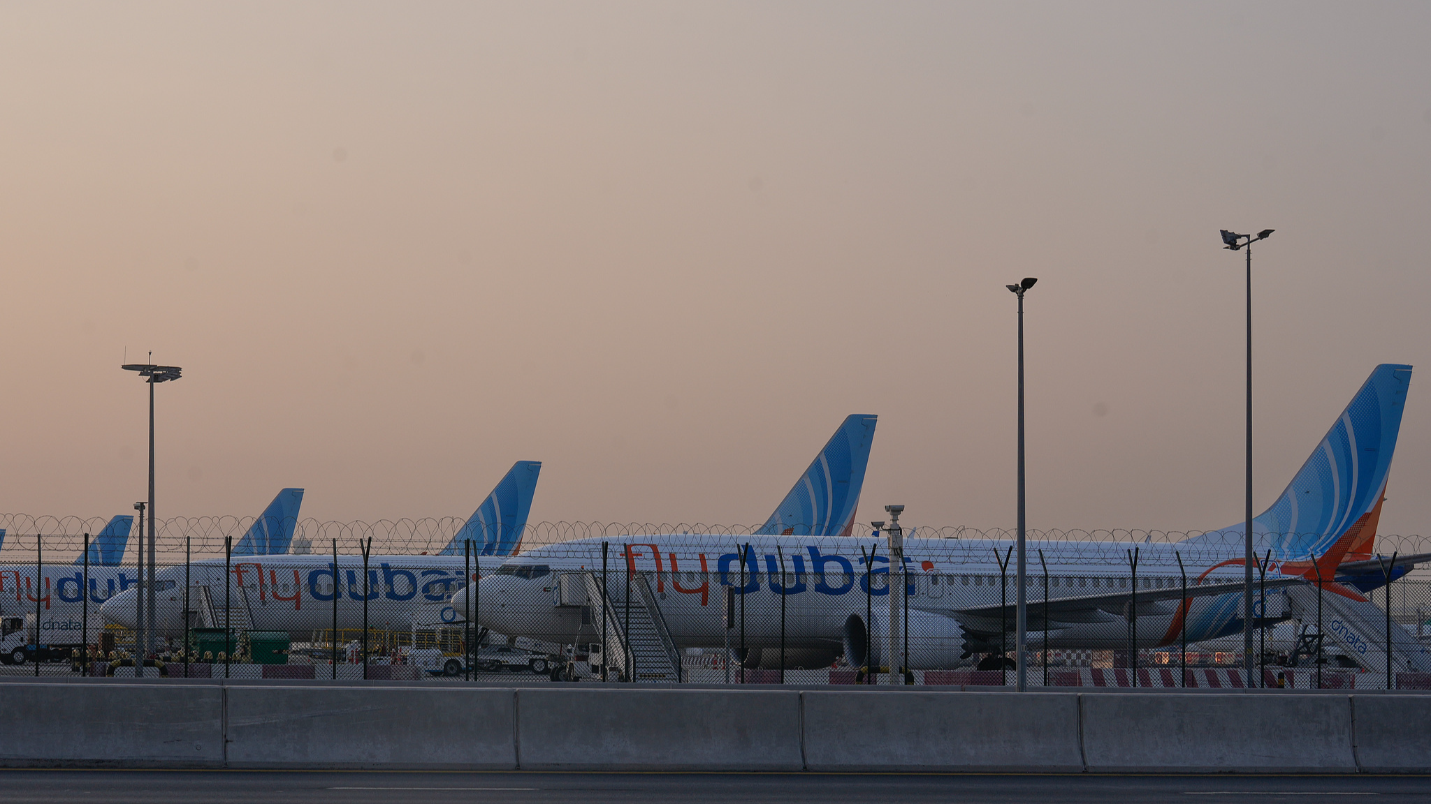 Airplanes are parked at the Dubai International Airport, Dubai, United Arab Emirates, Sunday, March 1, 2026. /VCG