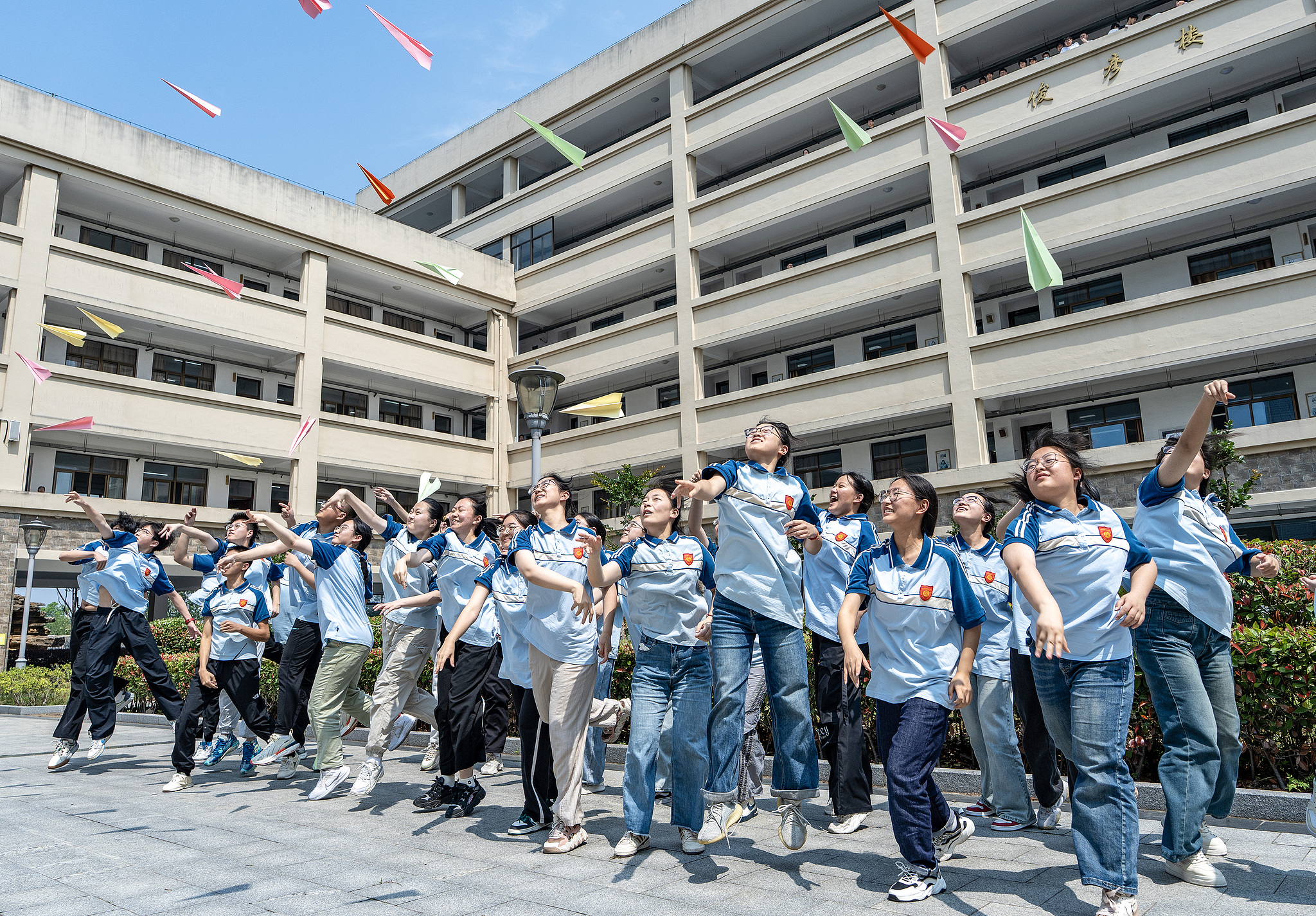 High school seniors throw paper airplanes into the air in Nantong, Jiangsu Province, June 4, 2025. /CFP
