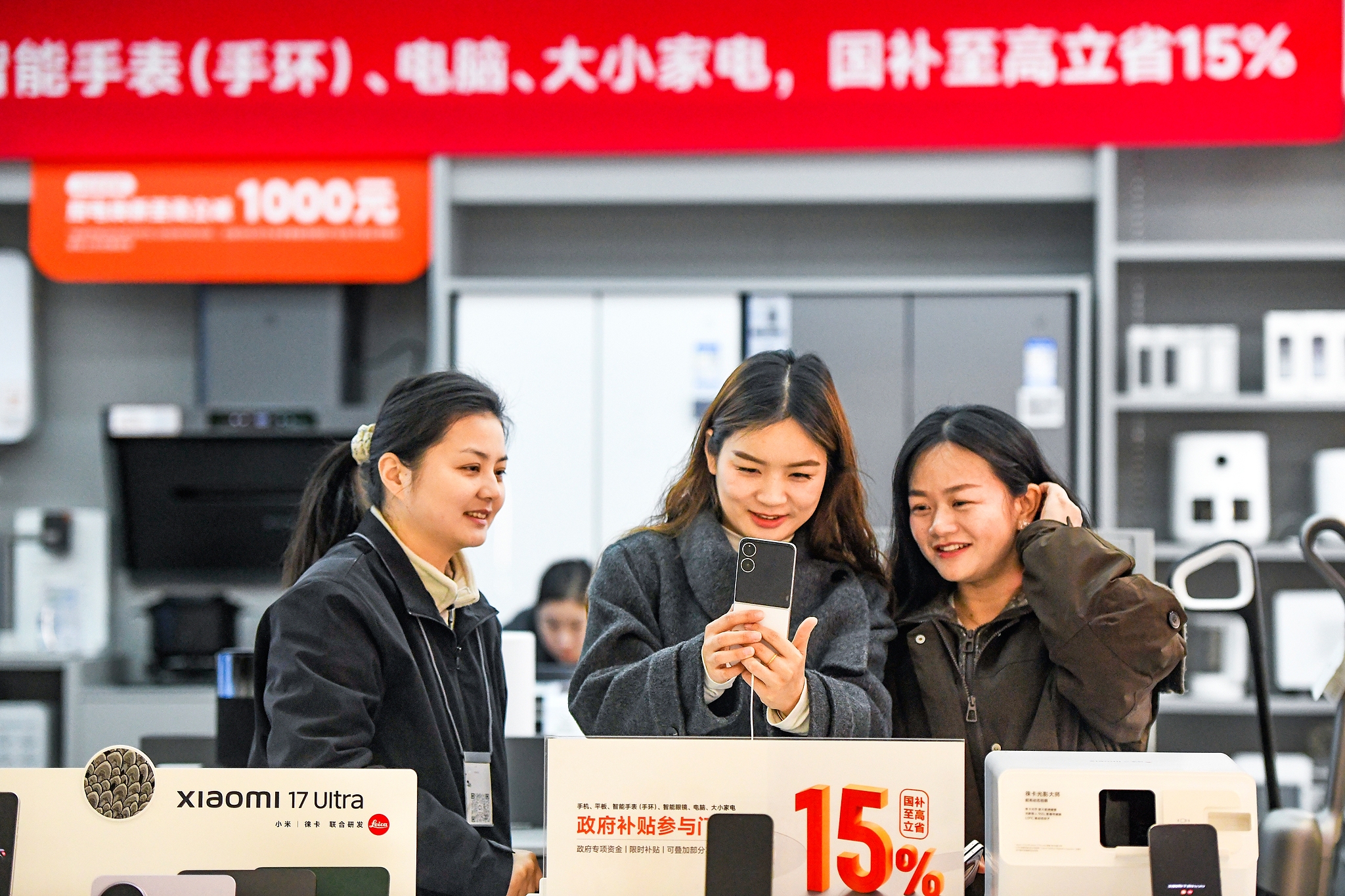 Consumers shop for mobile phones at a retail store in Huanggang, central China's Hubei Province, March 6, 2026. /VCG