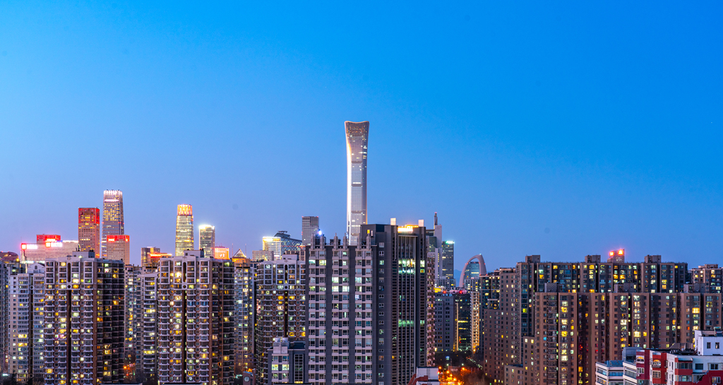 The Beijing CBD area and high-rise residential buildings illuminate the city skyline, China, February 7, 2026. /VCG