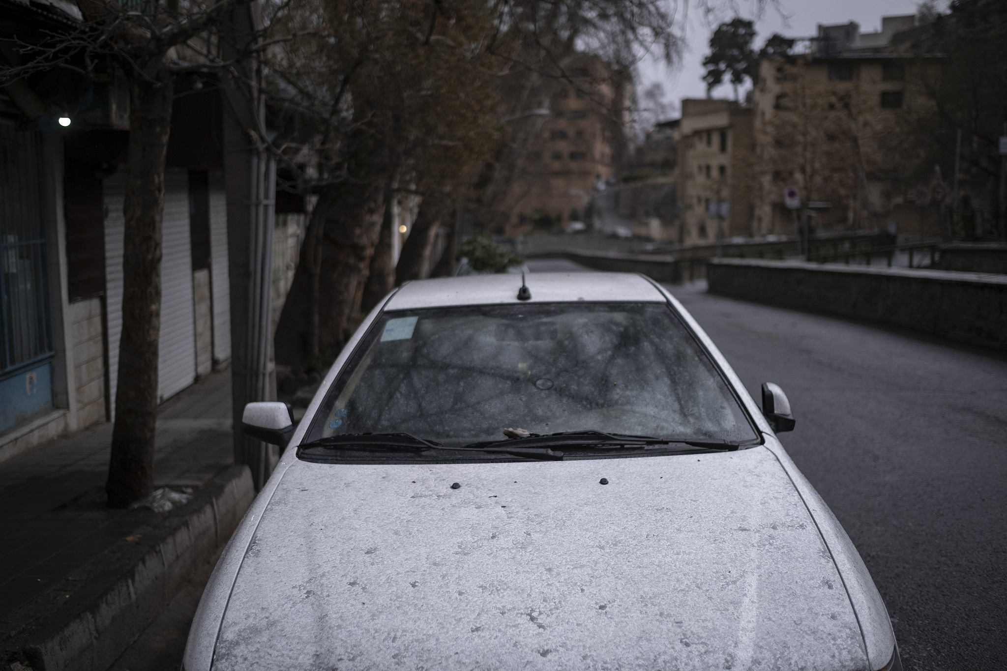 A vehicle is covered with oil-soot residue from Tehran's petroleum storage facilities, which are struck during US-Israeli military strikes, Tehran, Iran, March 8, 2026. /VCG