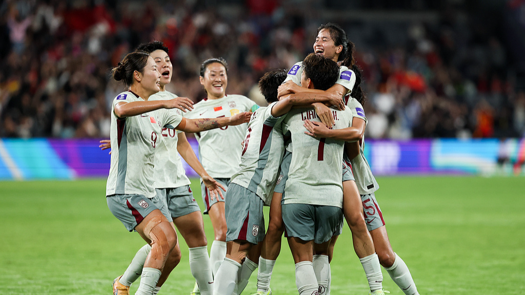 China's players celebrate after Chen Qiaozhu (top R) scored a goal against the DPRK in a Group B match at the 2026 AFC Women's Asian Cup at Western Sydney Stadium in Sydney, Australia, March 09, 2026 / VCG