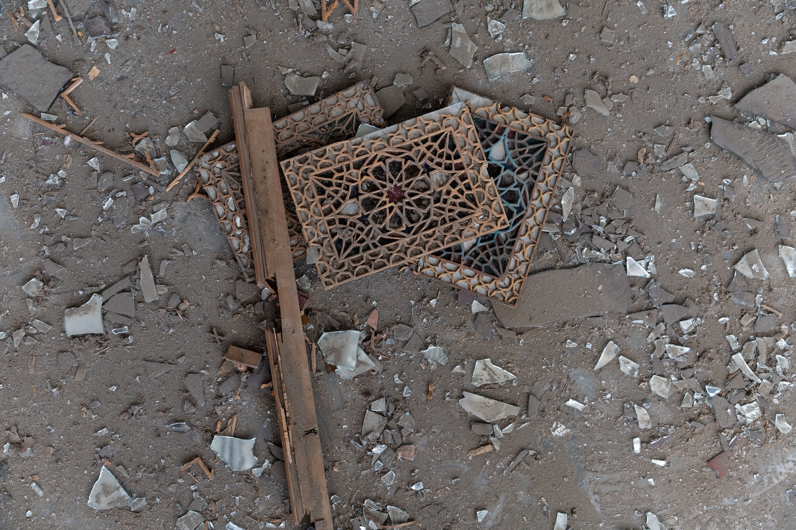 Shards of glass and decorations from the Golestan Palace lay scattered across the ground. /IC
