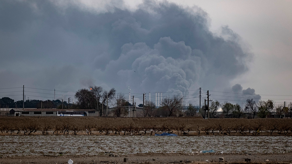 The sky is darkened by oil-soot residue from Tehran's petroleum storage facilities, which were struck during a US-Israeli military campaign in Tehran, Iran, March 9, 2026. /VCG