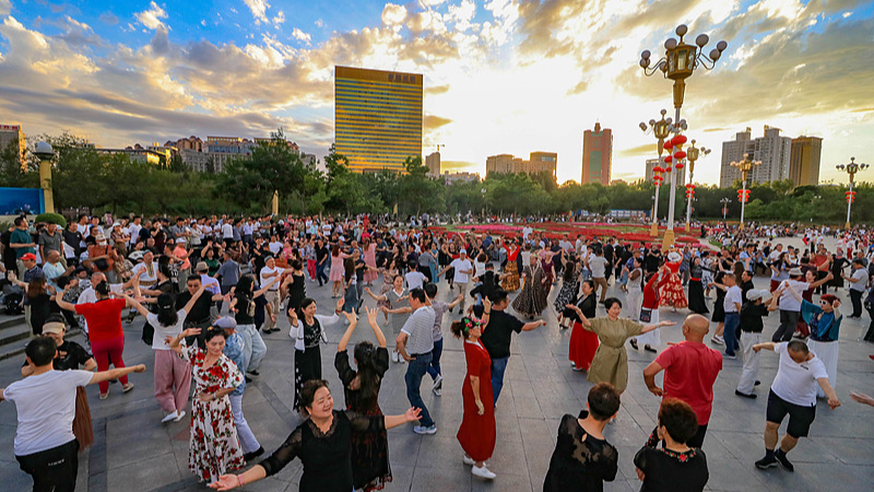 People of various ethnic groups dance the Meshrep at Nanhu Citizen Square in Urumqi, Xinjiang Uygur Autonomous Region, July 3, 2024. /CFP