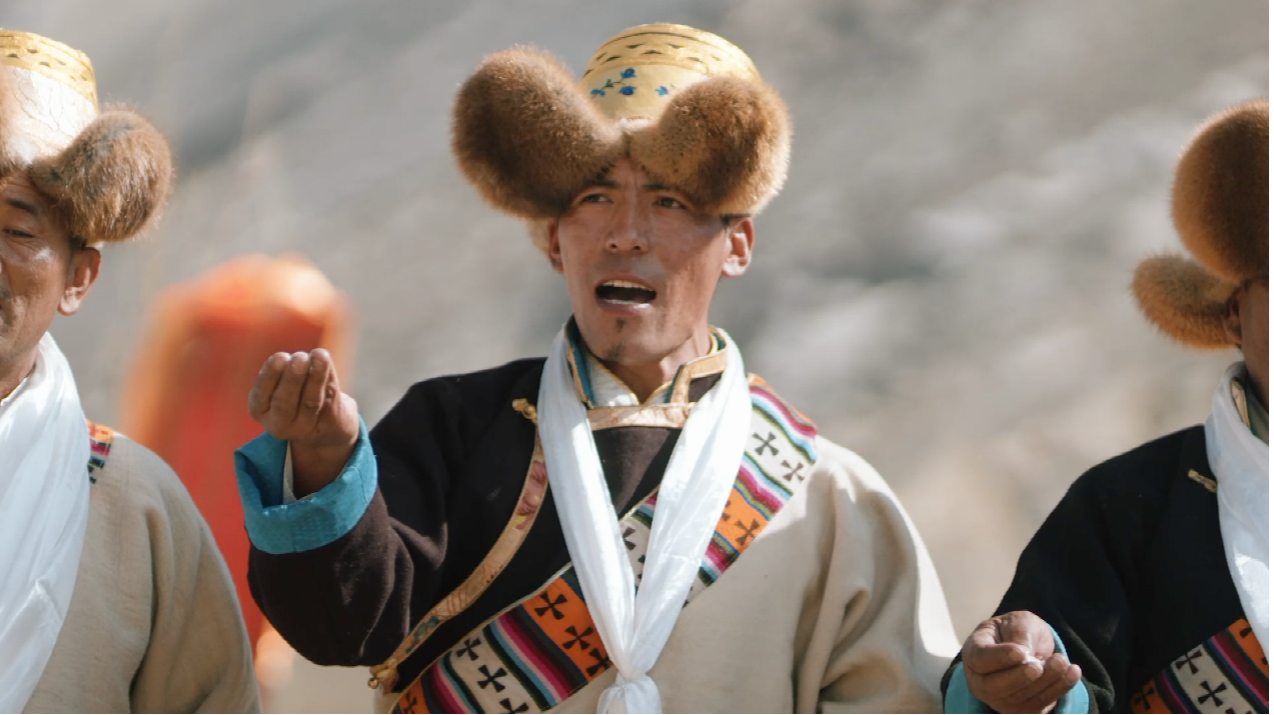 Locals dressed in traditional ethnic costumes take part in the 