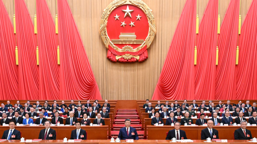 China's national legislature holds closing meeting of annual session
