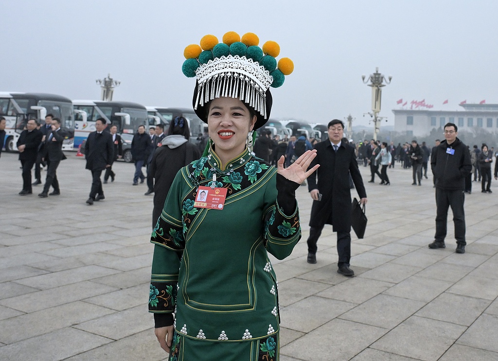 NPC deputy Jin Ruirui wore a green Yi embroidered outfit at this year's Two Sessions in what she called a symbol of 
