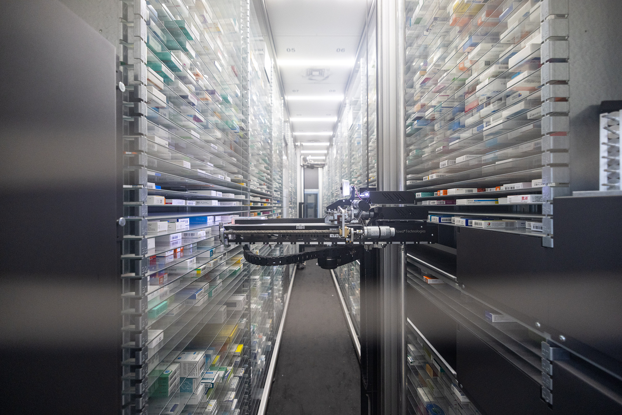 An automated dispensing robot prepares medications at a 