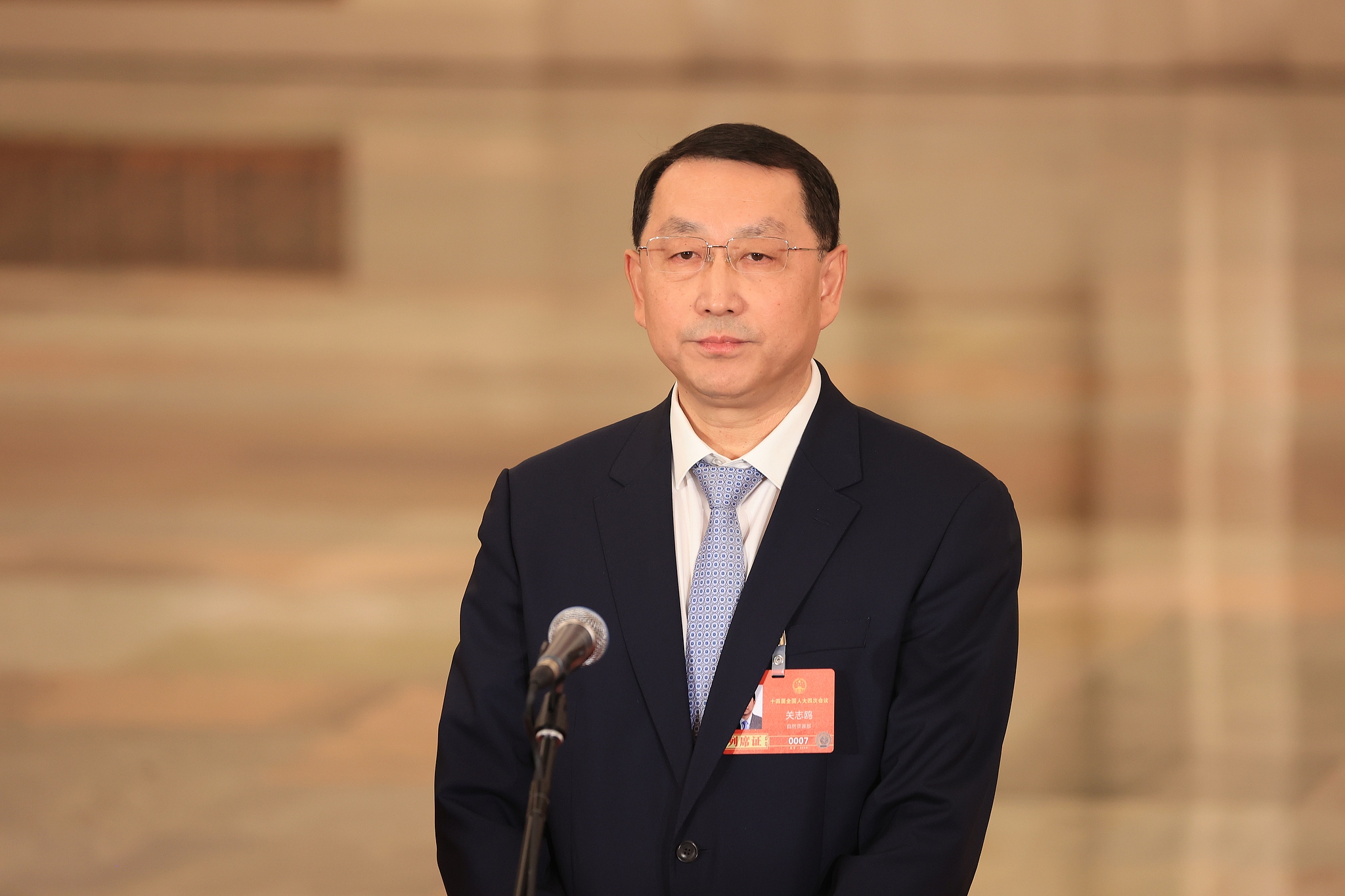 Chinese Minister of Natural Resources Guan Zhi'ou speaks at the Ministers' Corridor interview in Beijing, China, March 12, 2026. /VCG