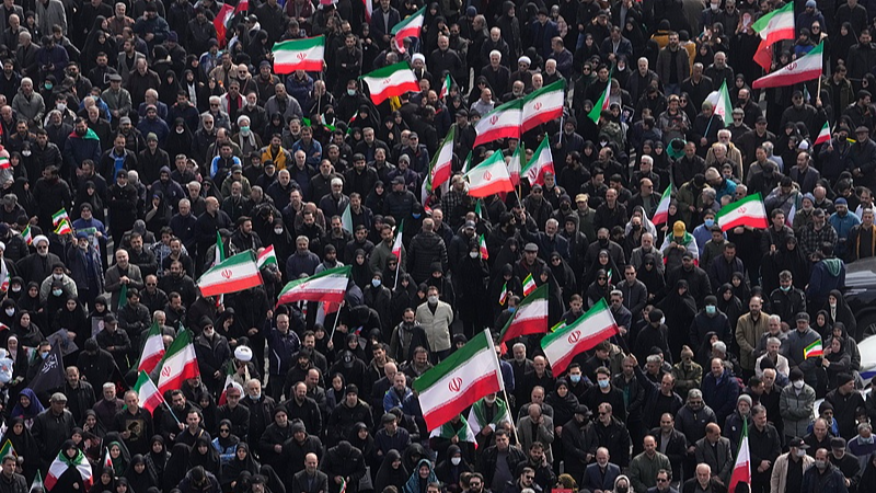 Mourners hold Iranian flags during a funeral procession for senior Iranian military officials and civilians killed during the US-Israel campaign, Tehran, Iran, March 11, 2026. /VCG