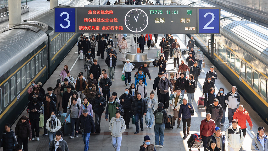 Passengers arrive at Nanjing Railway Station in Nanjing, Jiangsu Province of China, March 13, 2026. /VCG
