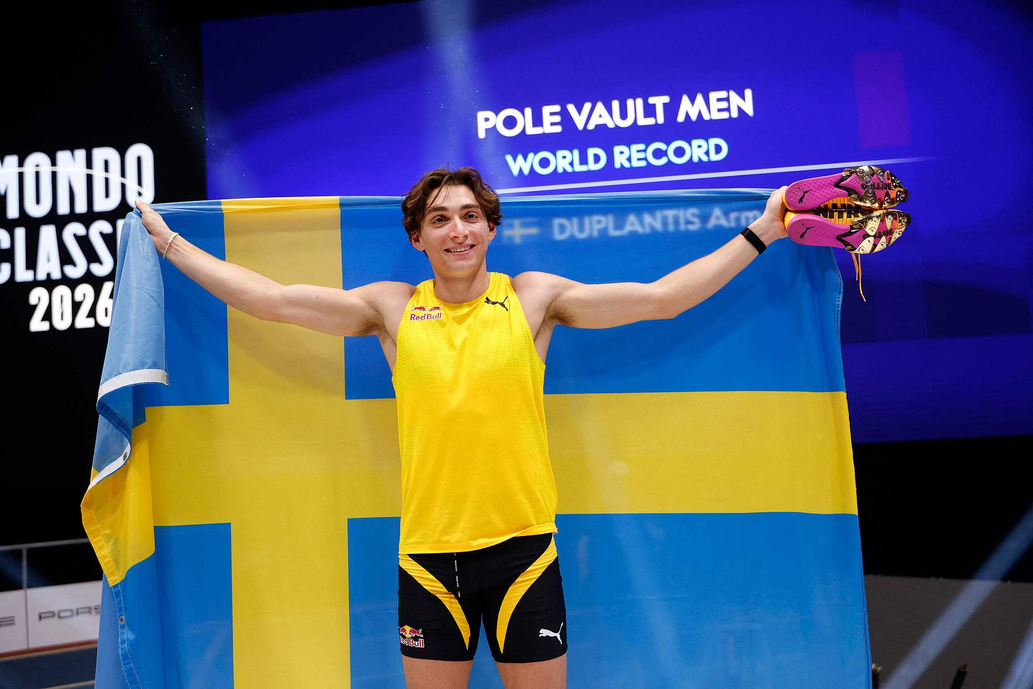 Swedish gold medalist Armand Duplantis celebrates after clearing 6.31 meters to set a new world record in the pole vault at the Mondo Classic in Uppsala in Sweden, March 12, 2026. /VCG