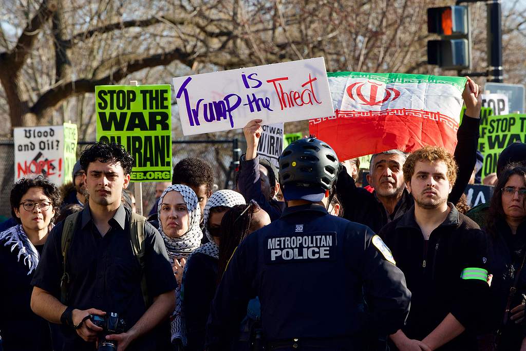 Police stand in front of demonstrators gathering in front of the White House to protest against the war with Iran in Washington, D.C., US., March 7, 2026. /VCG