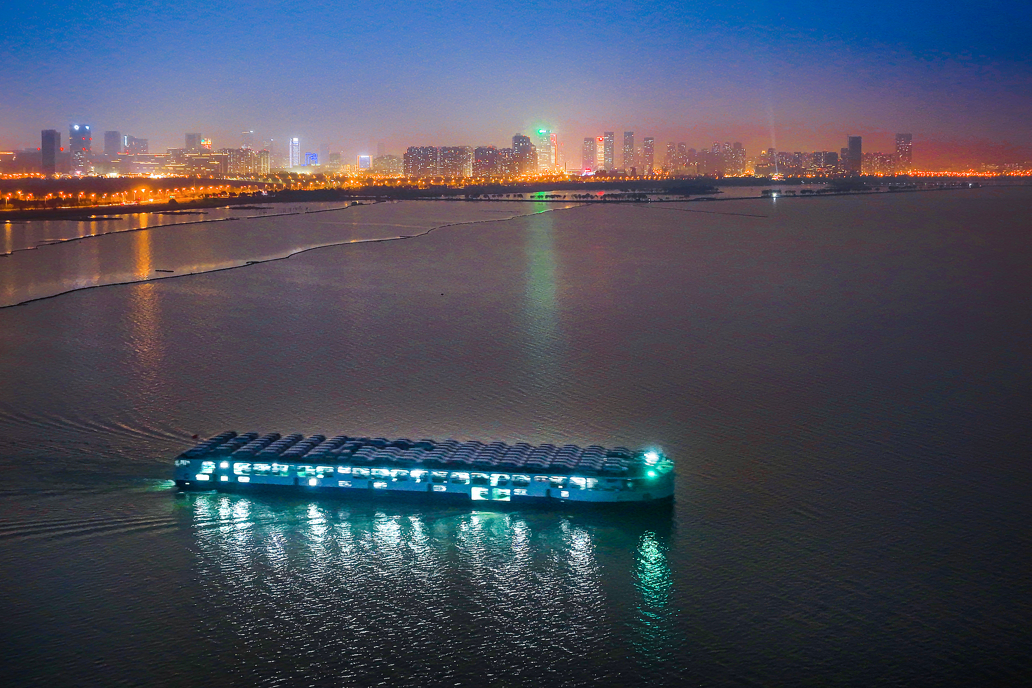 A roll-on/roll-off ship loaded with BYD new energy vehicles sets sail in Hefei, Anhui Province, China, March 9, 2026. /VCG