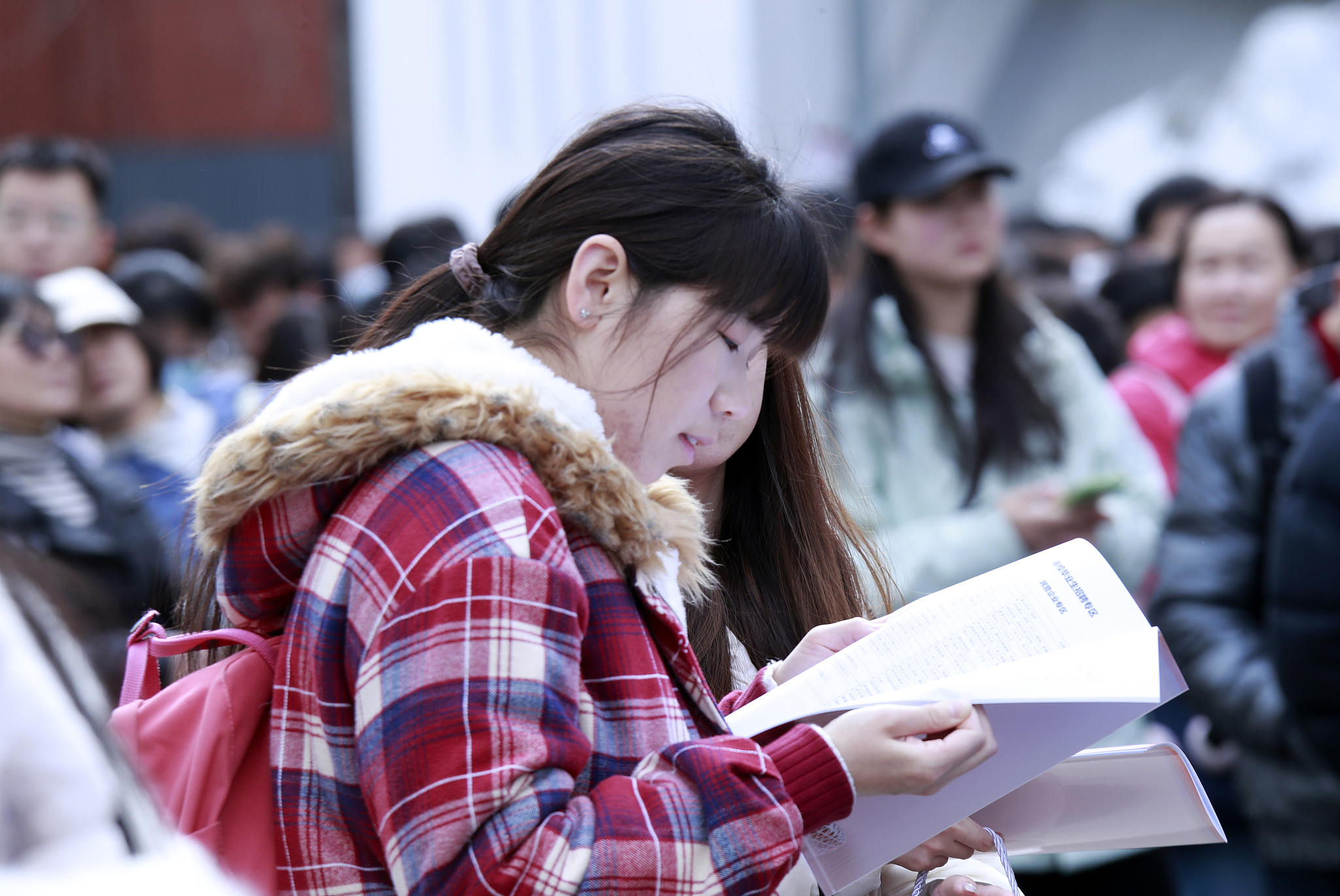 Job seekers attend a large-scale job fair at the China International Exhibition Center in Beijing, March 14, 2026. /VCG