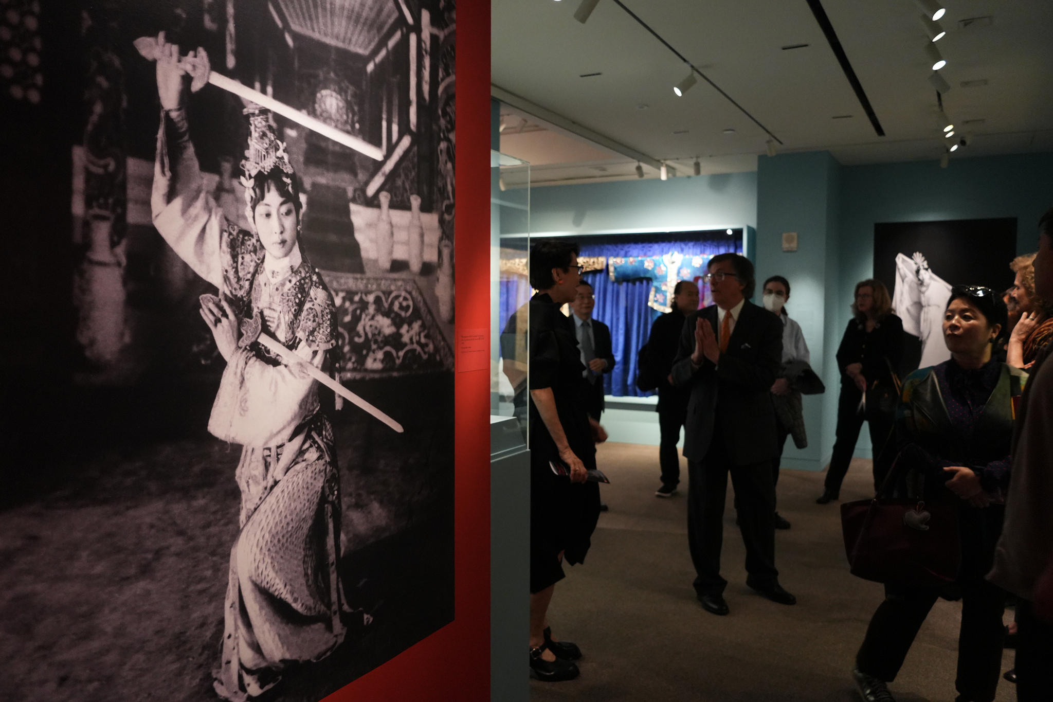 Visitors view a photograph of Mei Lanfang performing in the classic Peking Opera piece 