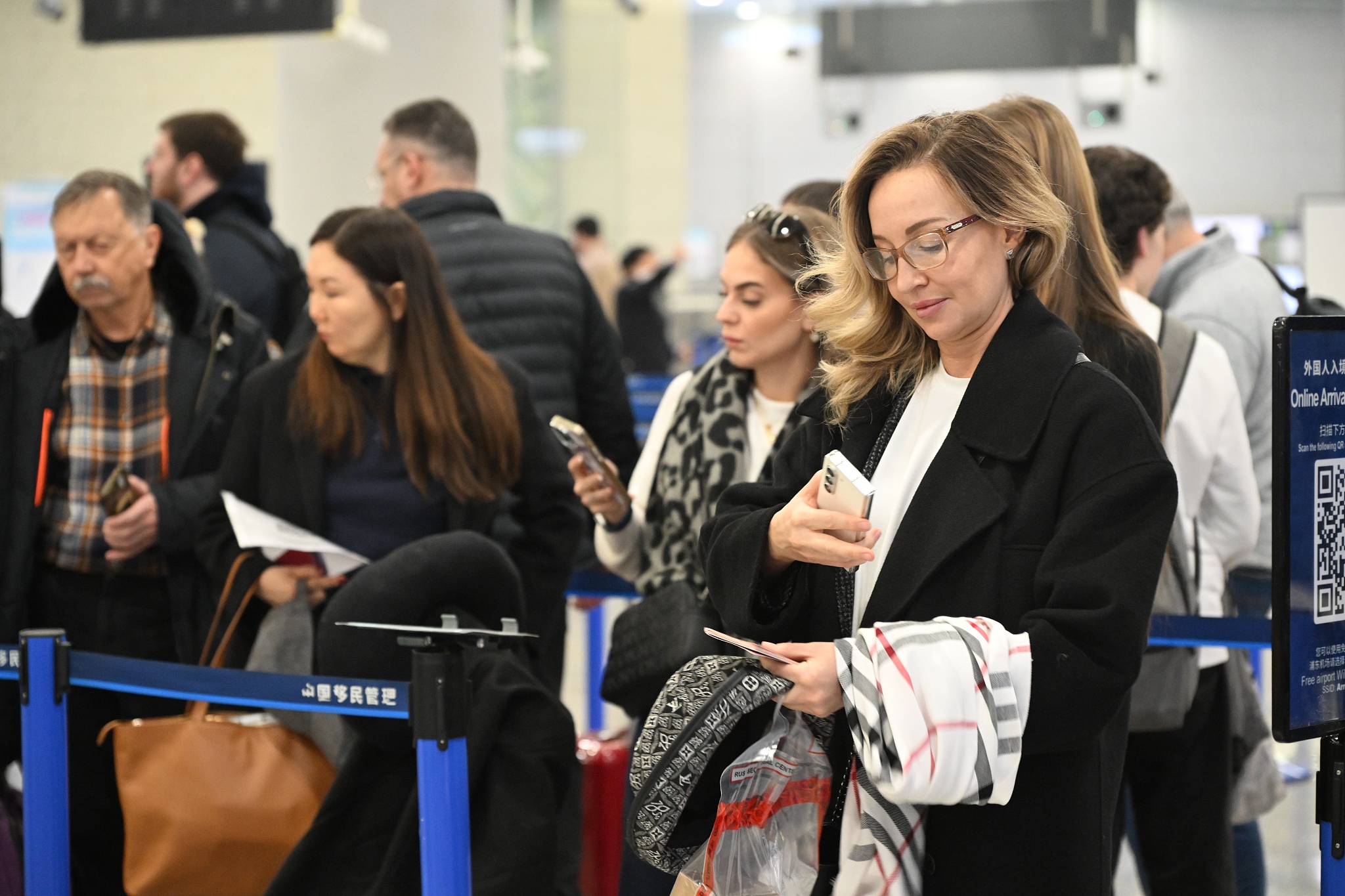 International passengers crowd the Terminal 2 departure hall at Shanghai Pudong International Airport in Shanghai  on December 30, 2025. /VCG