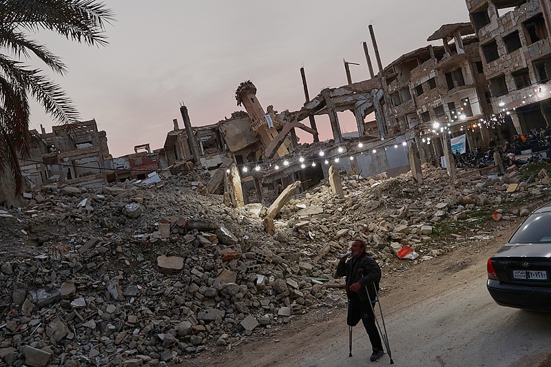 A man drinks yogurt before iftar, the Ramadan fast-breaking meal, organized by the Muslim humanitarian aid organization Hasene for residents of the Jobar neighborhood, which was devastated by the Syrian war, in Damascus, Syria, March 1, 2025. /VCG