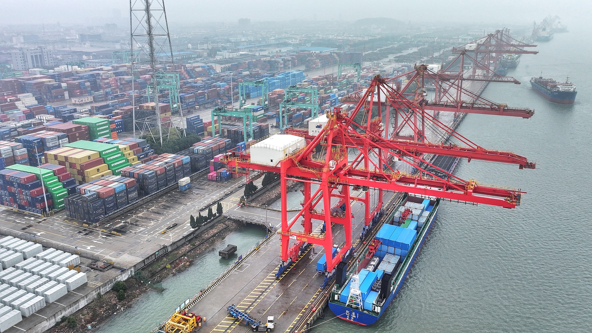 Container operations in progress at the container terminal in Zhangjiagang, Jiangsu Province, China, on March 16, 2026. /VCG