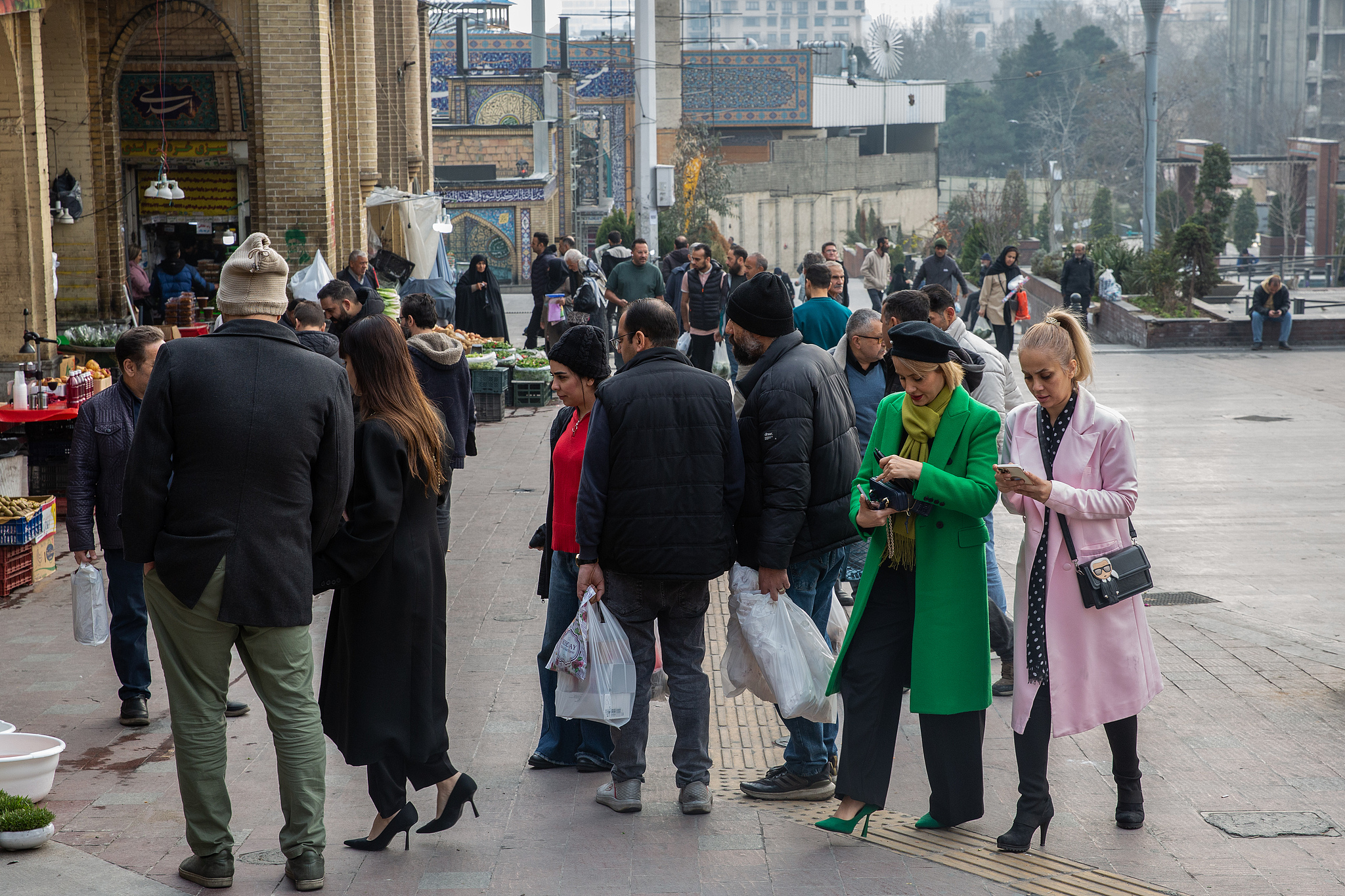 People walk near Tajrish Bazaar amid US-Israeli airstrikes on Tehran, Iran, March 14, 2026. / CFP 