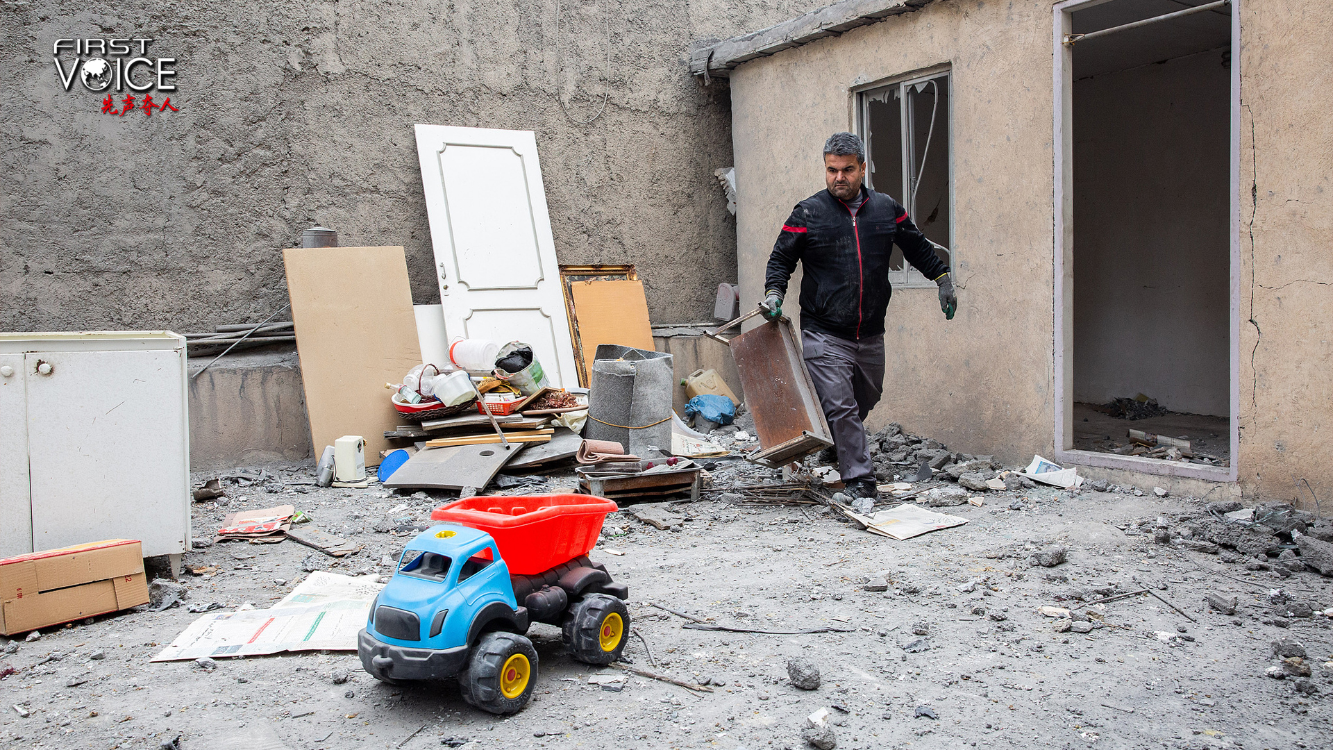 A man is clearing up his belongings from his home after it was targeted by US-Israeli airstrikes in Tehran, Iran, March 15, 2026. / CFP 