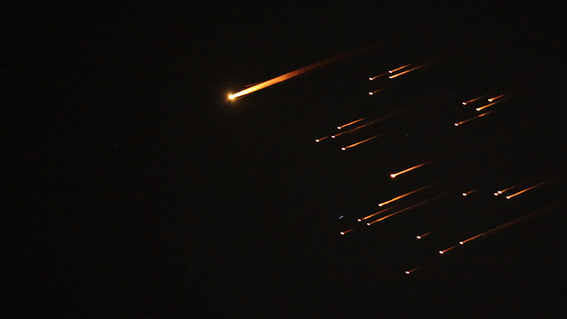 Missiles launched from Iran are seen in the skies over Hebron in the West Bank, March 18, 2026. /VCG