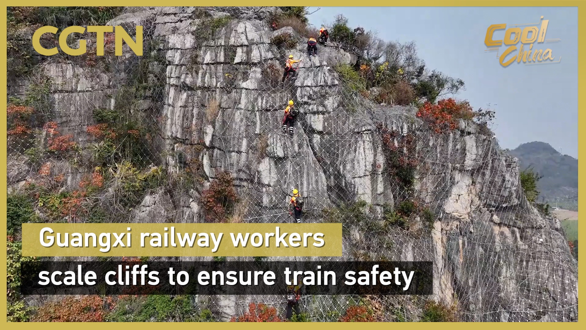 Guangxi railway workers scale cliffs to ensure train safety