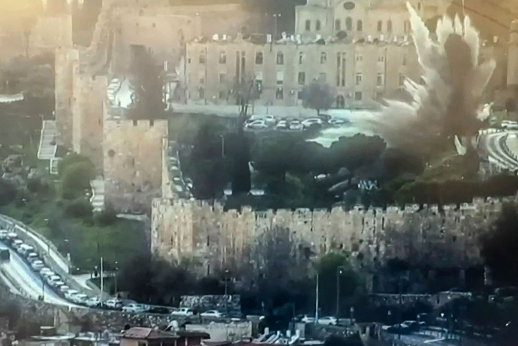 The moment of an impact, reportedly caused either by a missile or by interceptor fragments, inside the walls of Jerusalem's Old City, March 20, 2026. /VCG