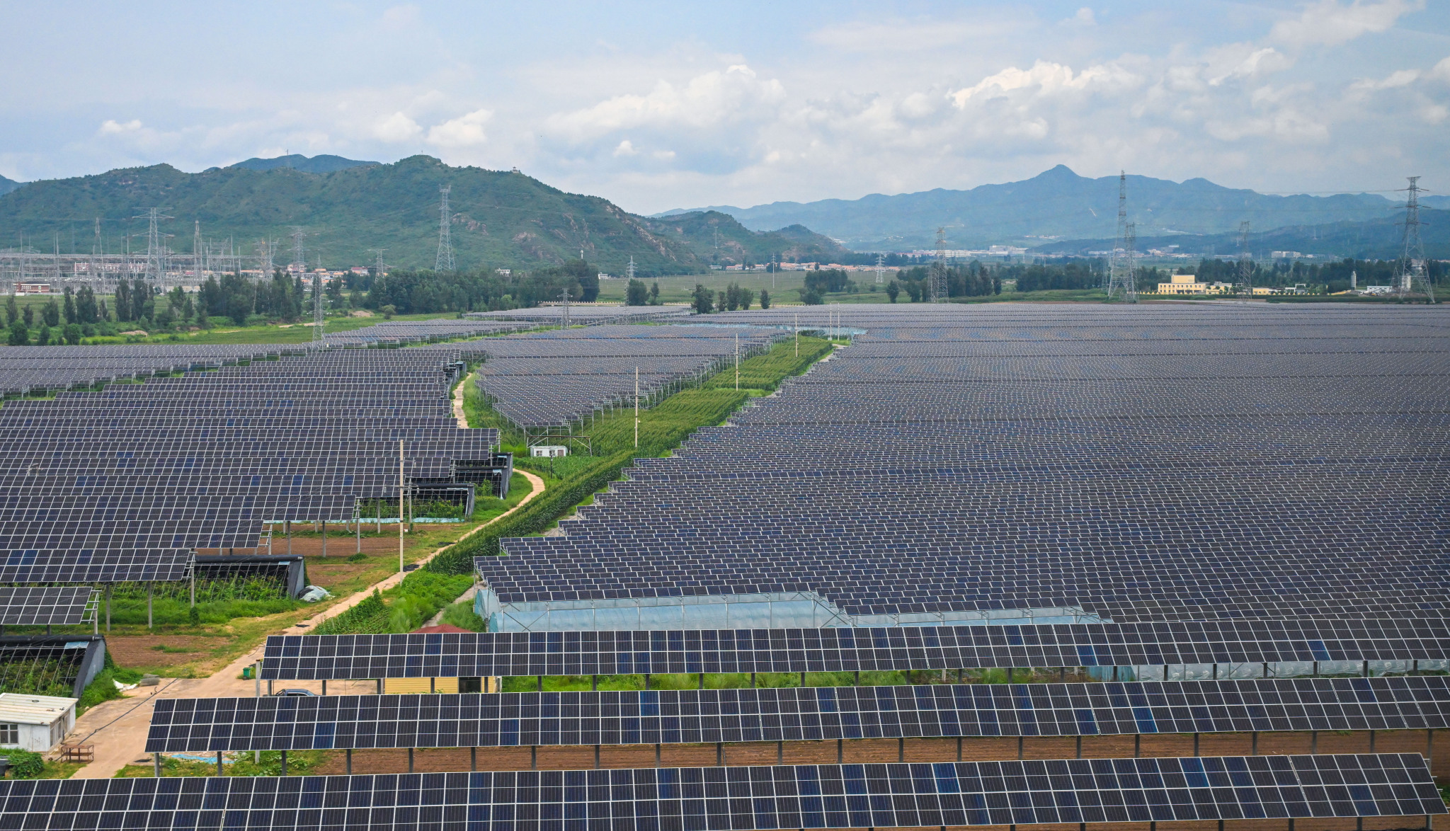 A large-scale solar photovoltaic power station in Chengde, Hebei Province, China, August 4, 2025. /VCG