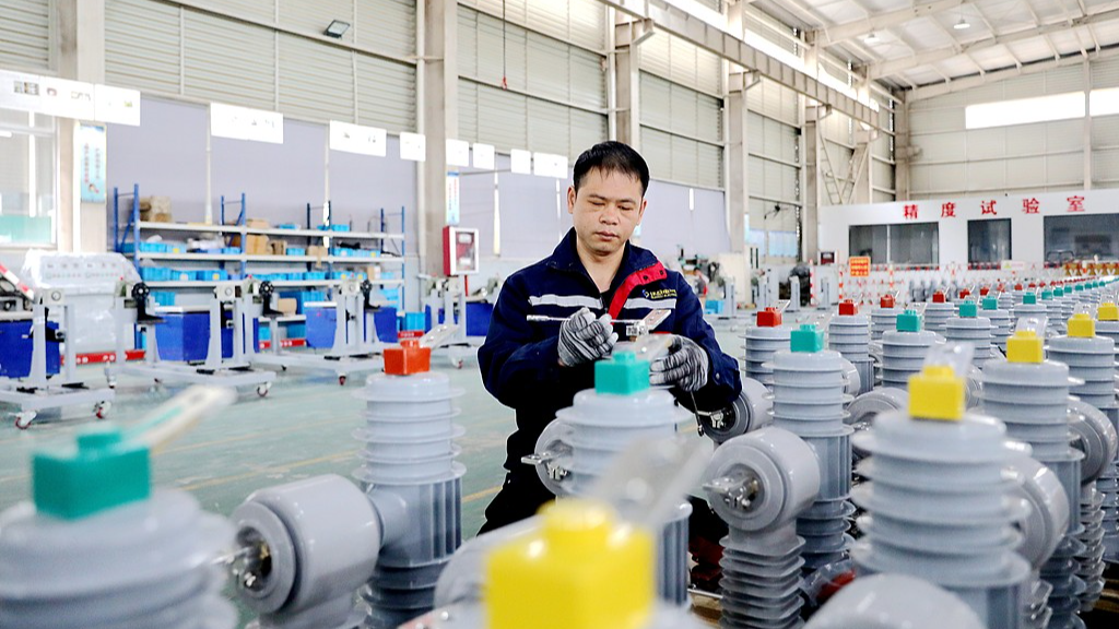 A worker assembles transformers at an electrical appliance factory in Xiajiang County, Ji'an City, east China's Jiangxi Province, February 25, 2026. /VCG