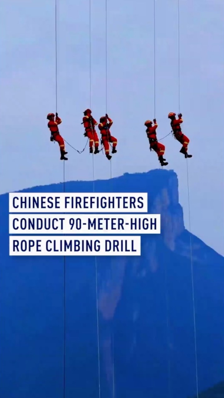 Chinese firefighters conduct 90-meter-high rope climbing drill