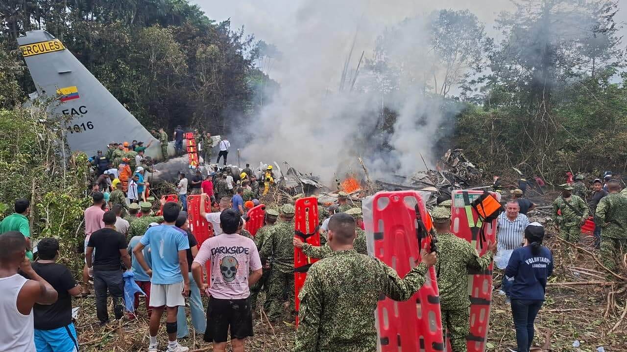 People stand around a military cargo plane that crashed after taking off from Puerto Leguizamo, Colombia, a remote municipality in the Amazonian province of Putumayo, March 23, 2026. /VCG