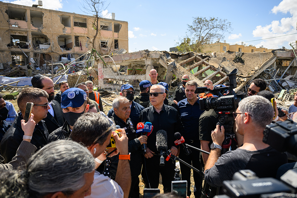 Israeli Prime Minister Benjamin Netanyahu speaks to media while visiting the area destroyed by an Iranian ballistic missile, leaving over 50 residents wounded, Dimona, Israel, March 22, 2026. /VCG