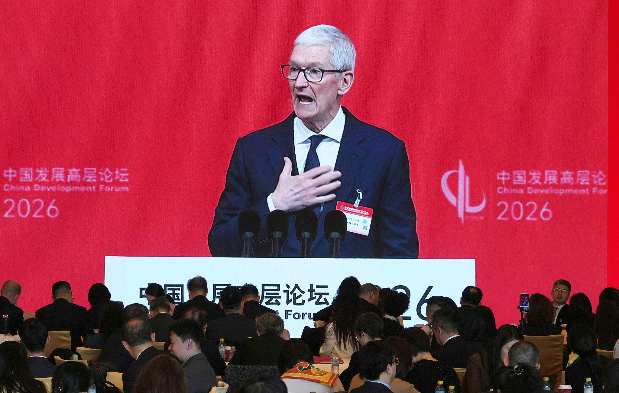 Apple CEO Tim Cook delivers a speech at the opening of the China Development Forum 2026 held in Beijing on March 22, 2026. /VCG