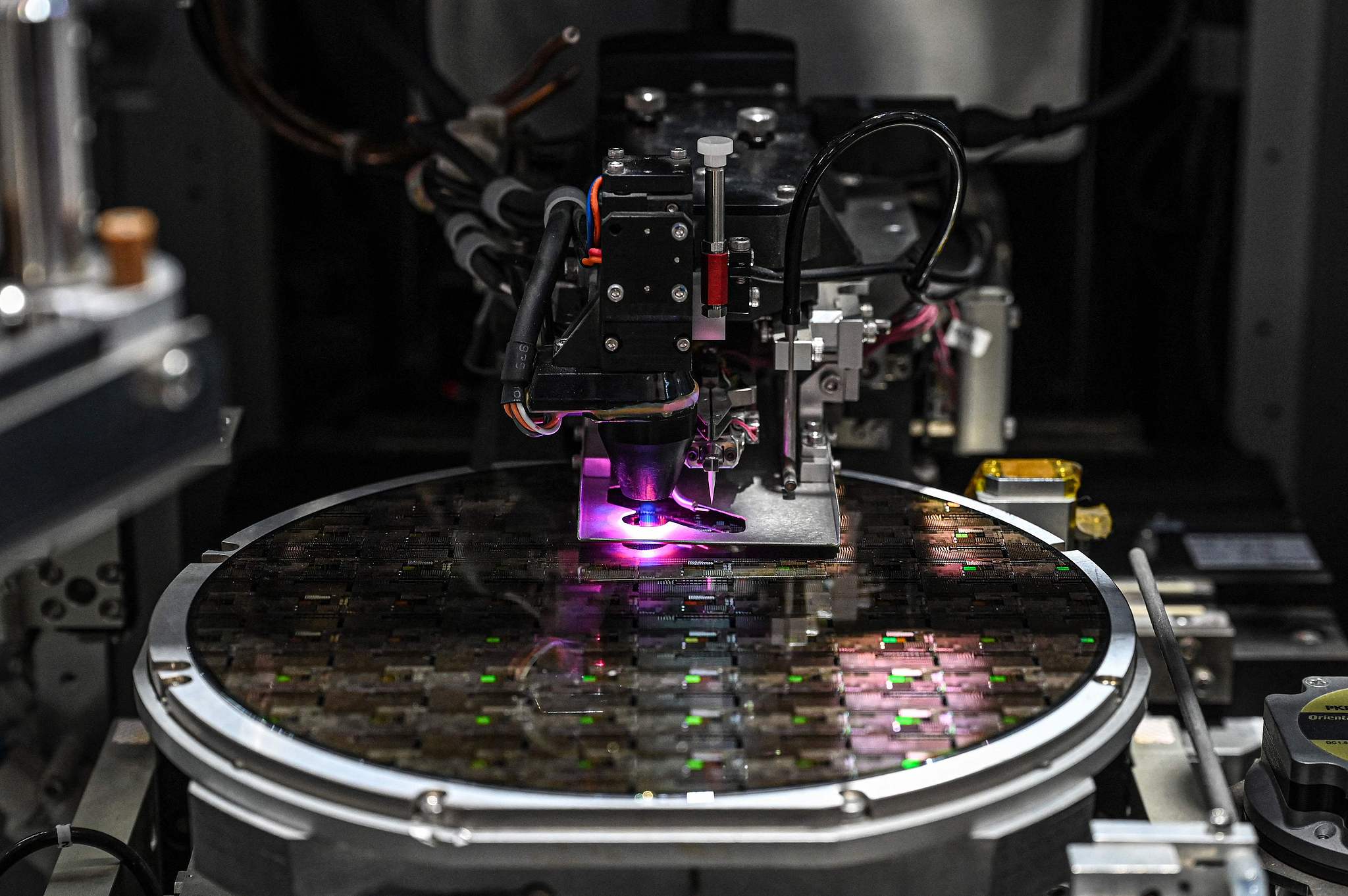 A wafer is pictured under process during the SEMICON China semiconductor exhibition in Shanghai on Mar 25, 2026. /VCG