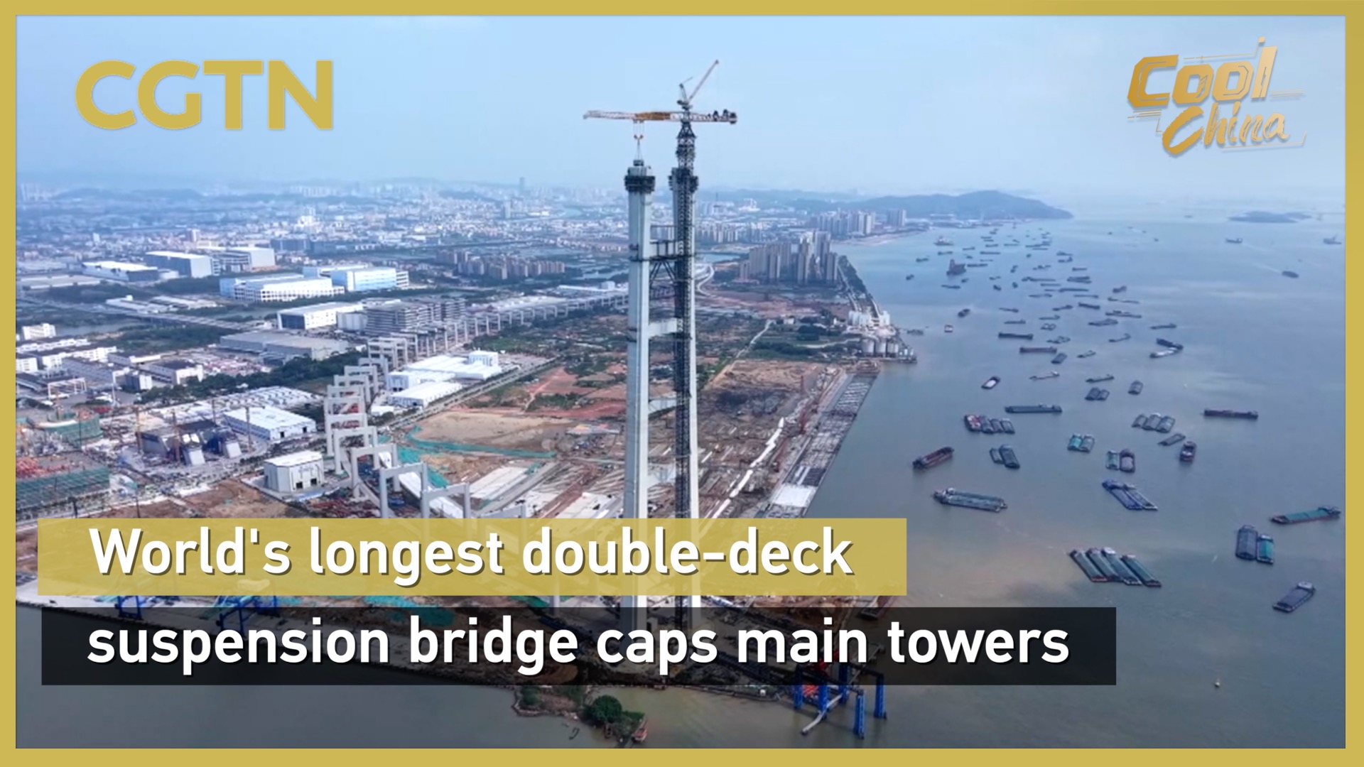World's longest double-deck suspension bridge caps main towers