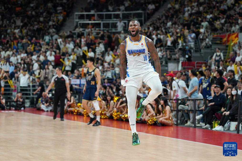 Eugene German of the Beijing Ducks celebrates after sinking a game-winning three-pointer against the Guangdong Southern Tigers in a Chinese Basketball Association game in Dongguan, south China's Guangdong Province, March 27, 2026. /Xinhua