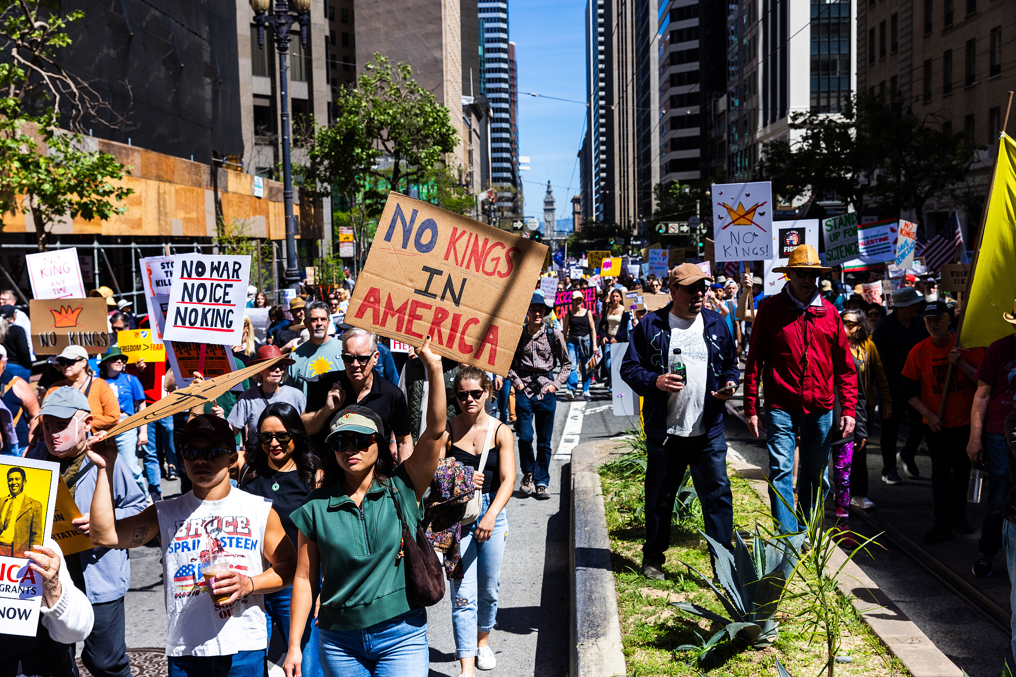 Protesters march on Market St. to Civic Center Plaza during the third 