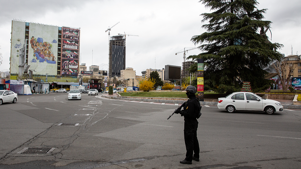A security force is standing near Vanak Square amid US-Israeli air strikes in Tehran, Iran, March 28, 2026. /VCG