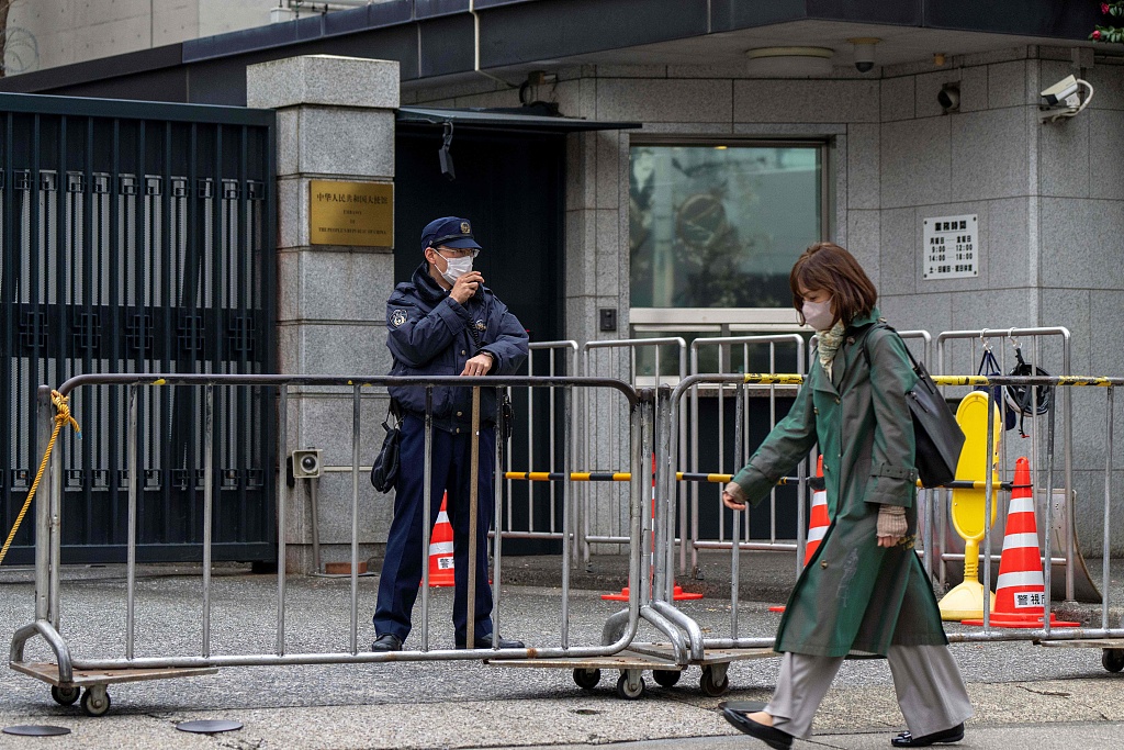 A policeman stands guard at an entrance to the Chinese embassy in Tokyo, Japan, on March 25, 2026. /VCG