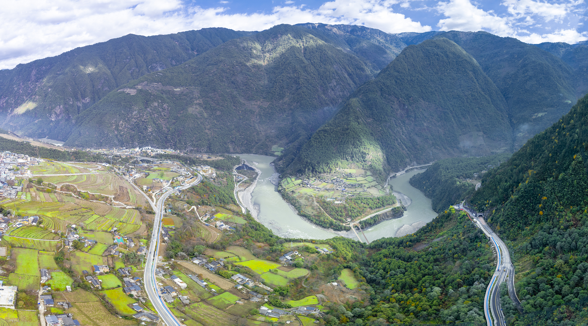 Bingzhongluo Town in Gongshan County sits like an emerald set within the dramatic bend of the Nu River, cradled between the Biluo Snow Mountains and the Gaoligong Mountains, December 5, 2023. /VCG