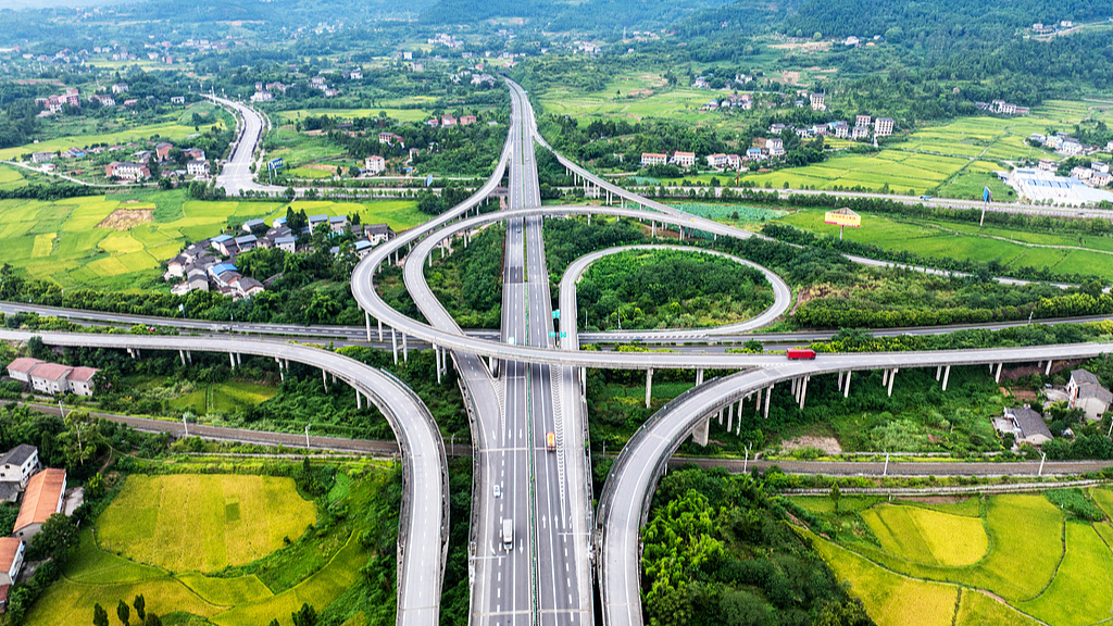 An aerial view of a high-speed interchange, urban-rural expressway and railway in Sichuan Province, China, December 10, 2025. / VCG